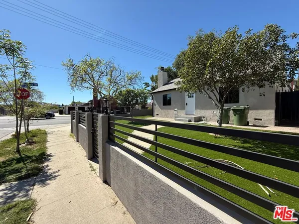 a view of a backyard with sitting area