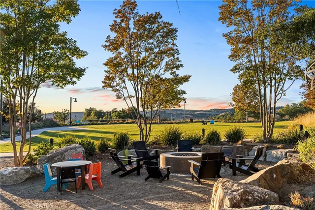 a view of a lake with a table and chairs