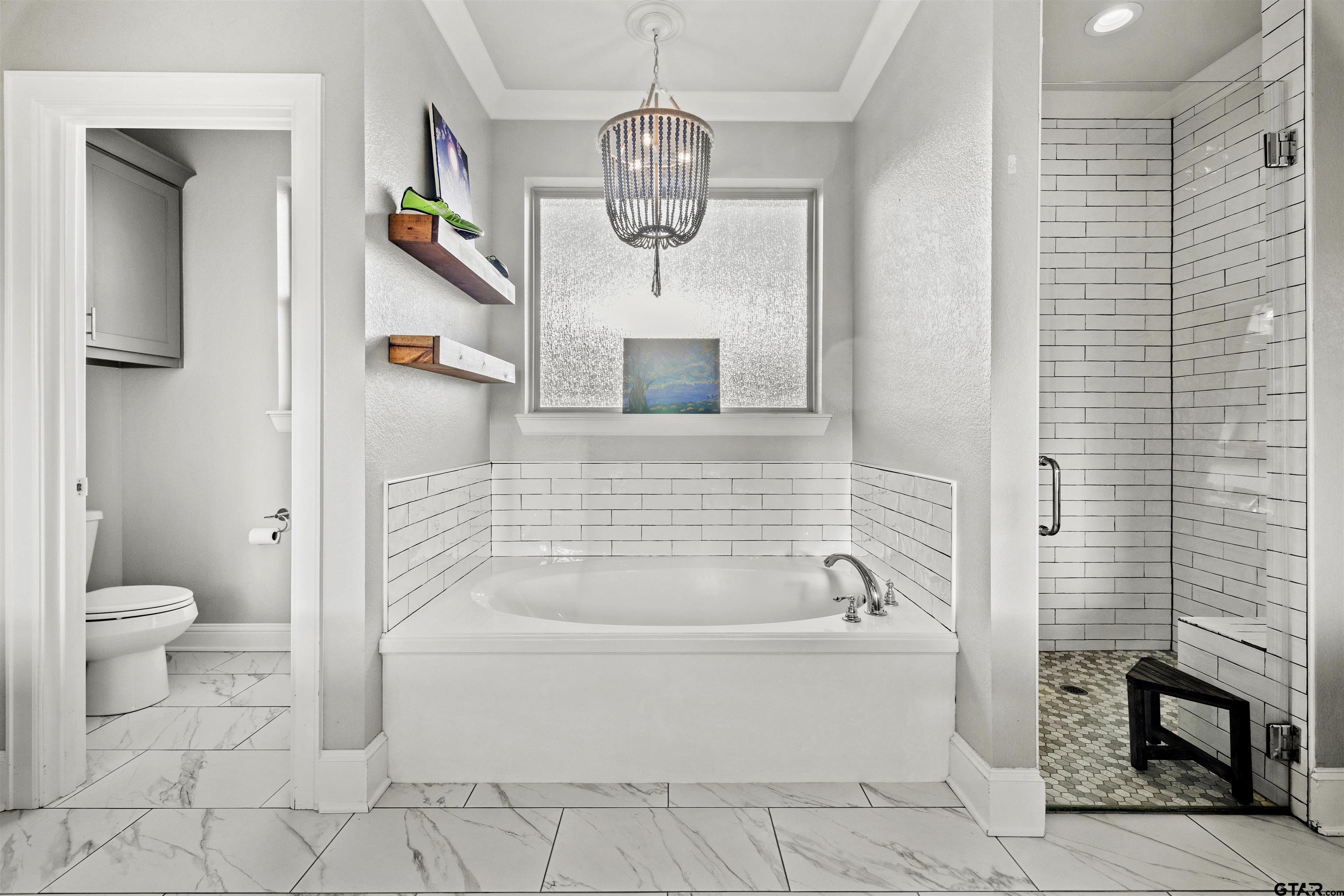 425 Coventry Street Bullard, TX 75757 - Photo 12 of 35 a bathroom with a granite countertop toilet a sink and bathtub