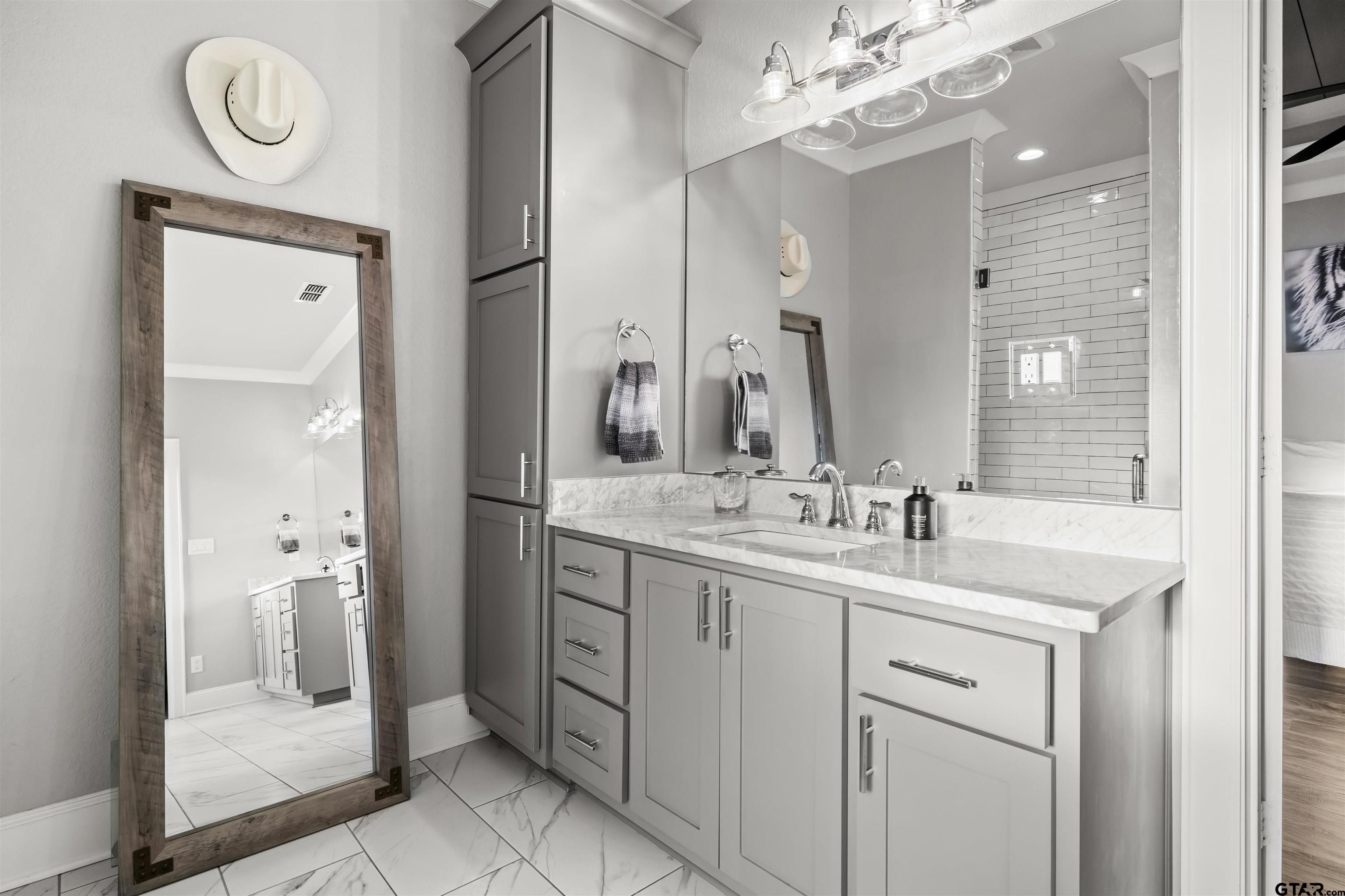 425 Coventry Street Bullard, TX 75757 - Photo 13 of 35 a bathroom with a double vanity sink mirror and shower