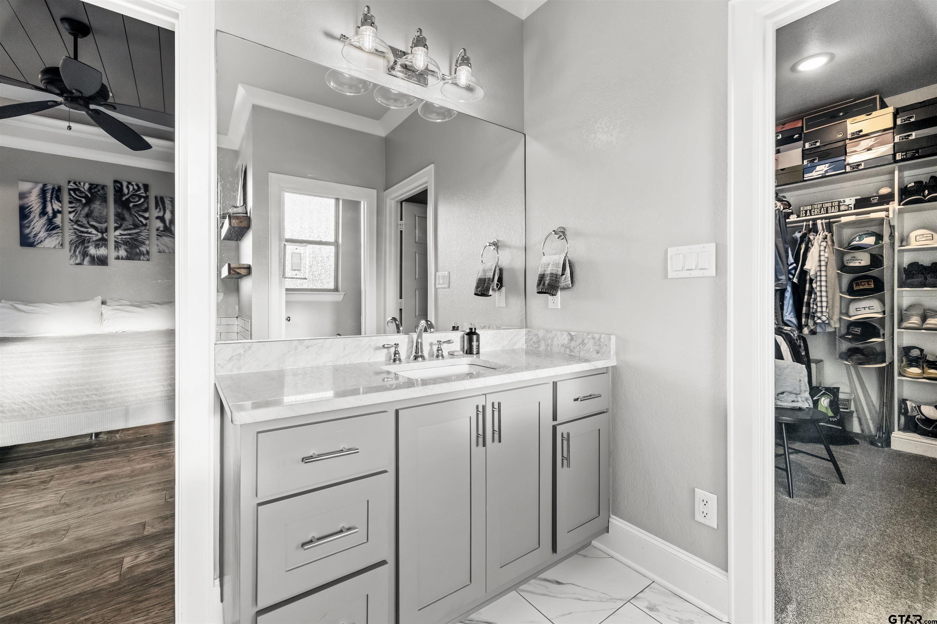 425 Coventry Street Bullard, TX 75757 - Photo 14 of 35 a bathroom with a double vanity sink a mirror and a shower