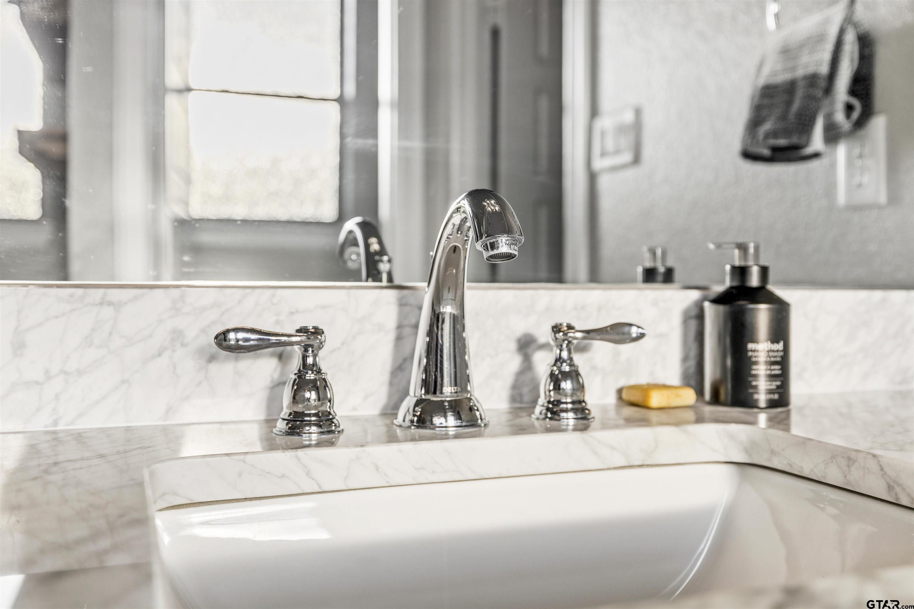 425 Coventry Street Bullard, TX 75757 - Photo 16 of 35 a bathroom with a sink and a mirror