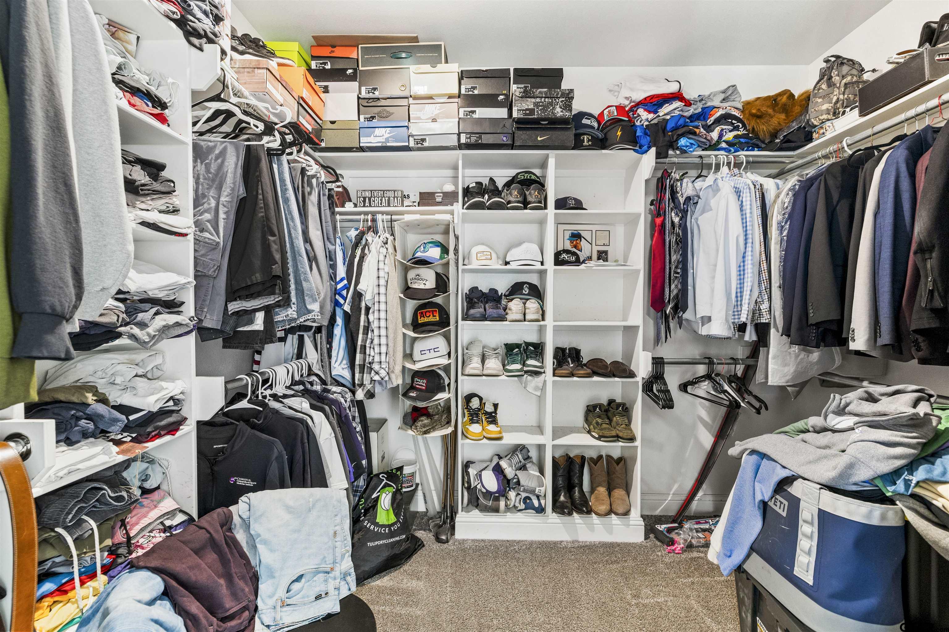 425 Coventry Street Bullard, TX 75757 - Photo 17 of 35 a view of walk in closet with clothes and shoes