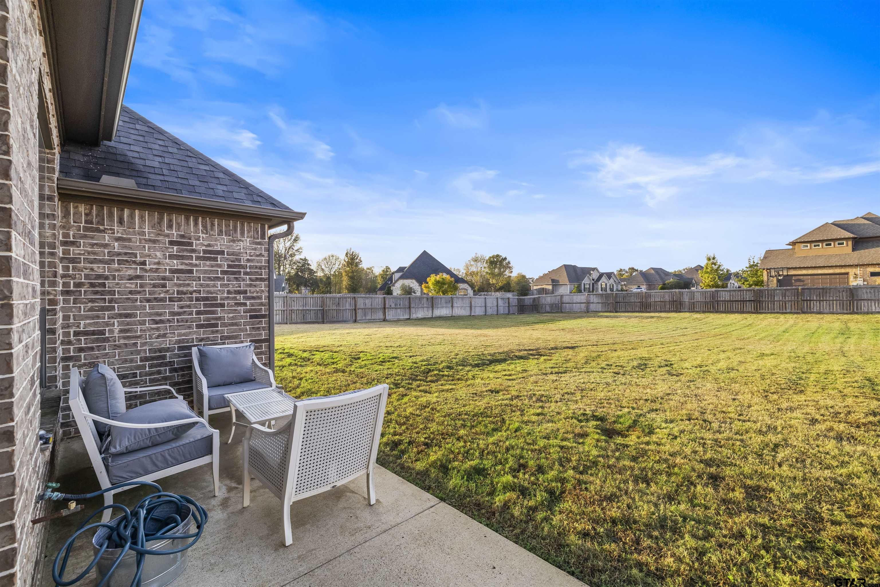 425 Coventry Street Bullard, TX 75757 - Photo 32 of 35 a view of a lake with table and chairs