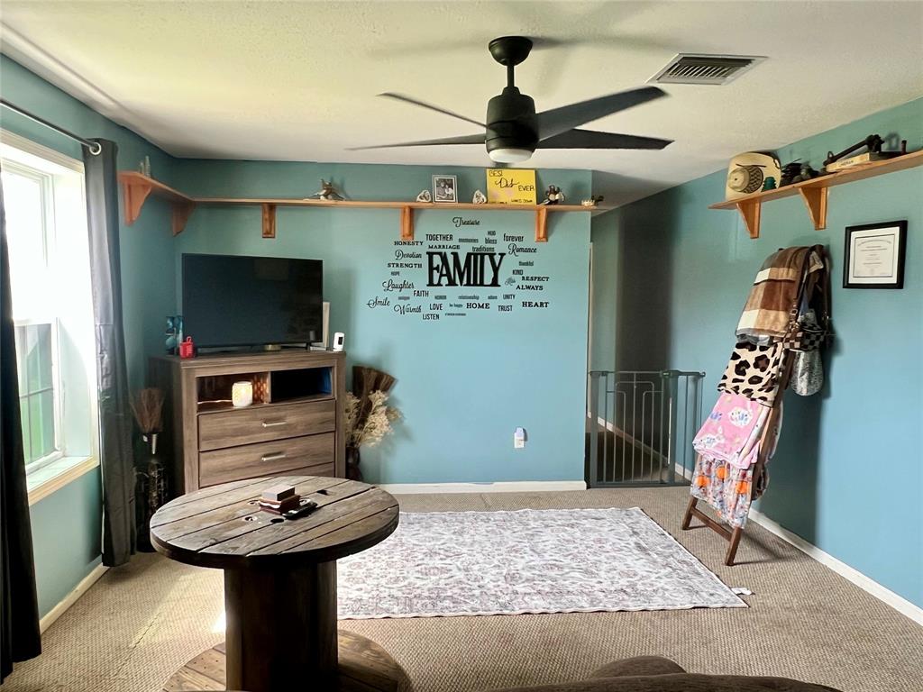 8971 Southeast 67th Drive Okeechobee, FL 34974 - Photo 5 of 14 a bathroom with a sink a mirror and shower