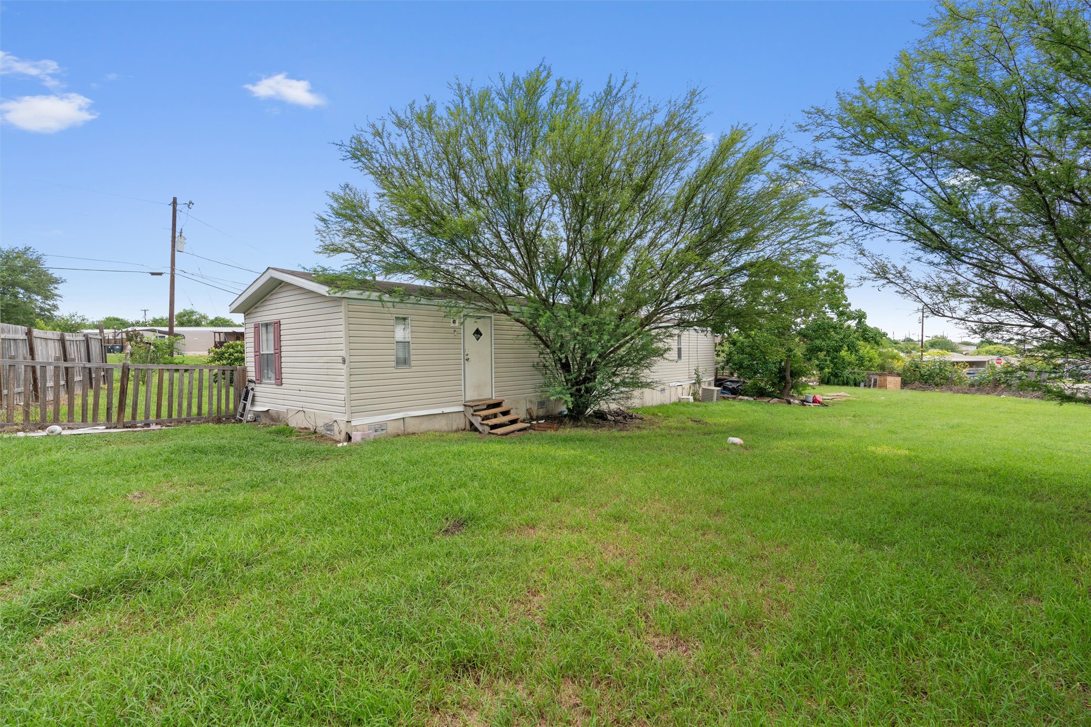 218 Boxcar Path Kyle, TX 78640 - Photo 13 of 21 A well-maintained lawn surrounds this charming home with ample outdoor space.
