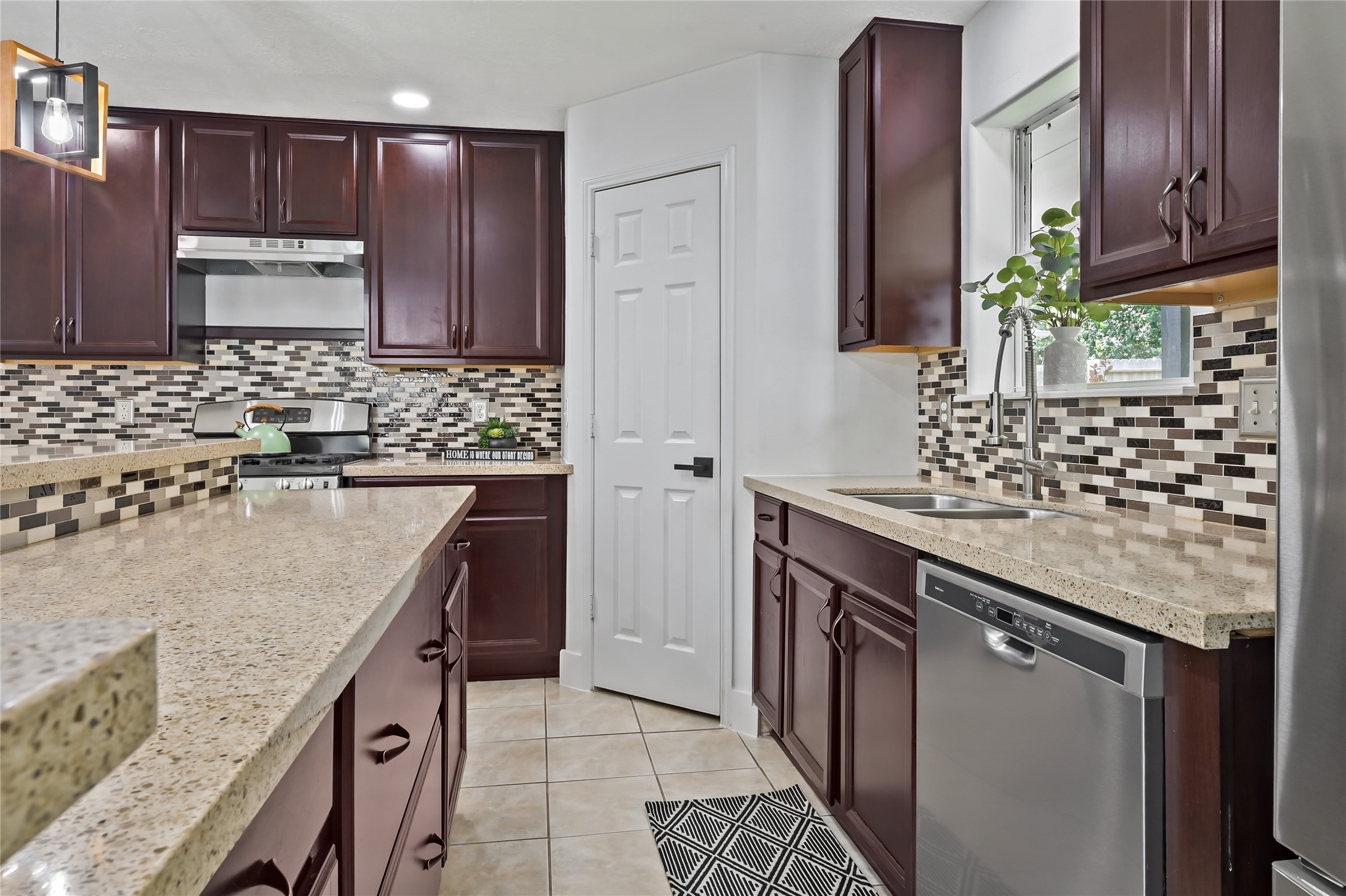 23311 Leafstone Lane Spring, TX 77373 - Photo 11 of 35 Kitchen with nice cabinetry, modern appliances, and ample counter space for culinary creativity.
