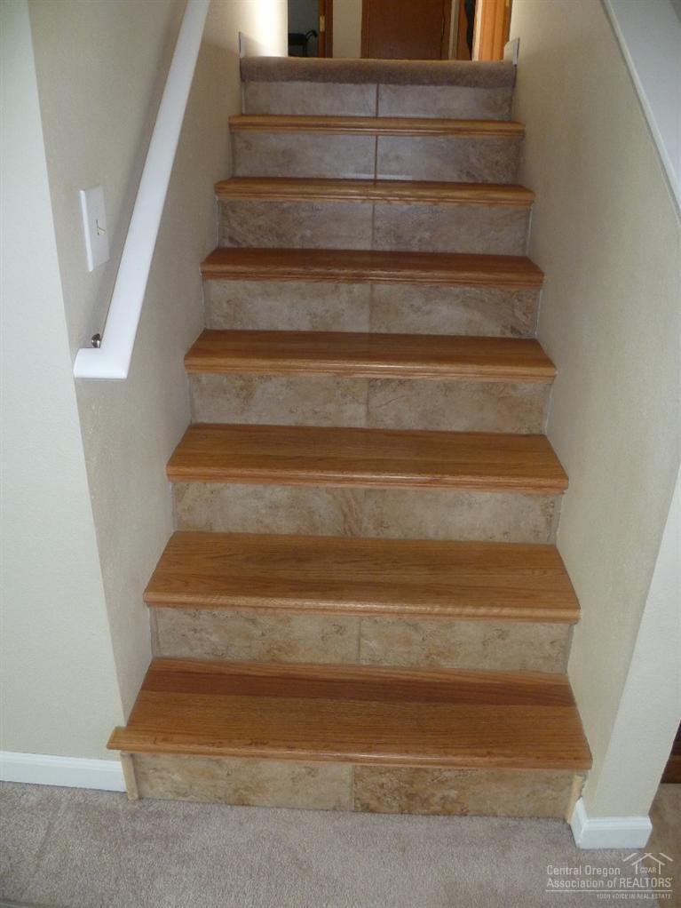 Handcrafted hardwood/tile stairs..... C