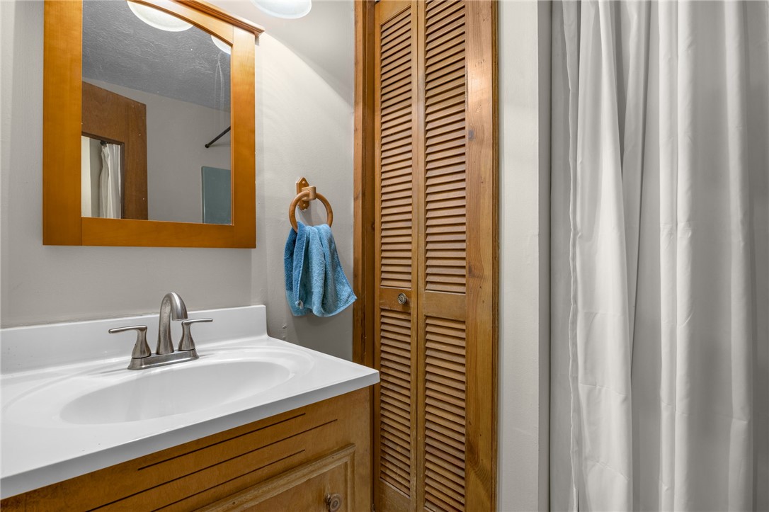 437 West Gate Road Pickens, SC 29671 - Photo 46 of 47 This clean and inviting bathroom features a single vanity with a sleek faucet and a mirror.
