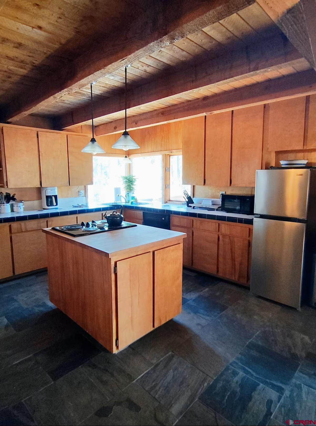360 Sortais Road Durango, CO 81301 - Photo 12 of 36 a kitchen with stainless steel appliances granite countertop a stove a sink and a refrigerator