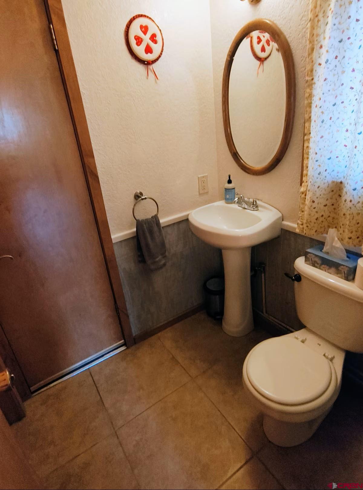 360 Sortais Road Durango, CO 81301 - Photo 17 of 36 a bathroom with a sink mirror vanity and toilet