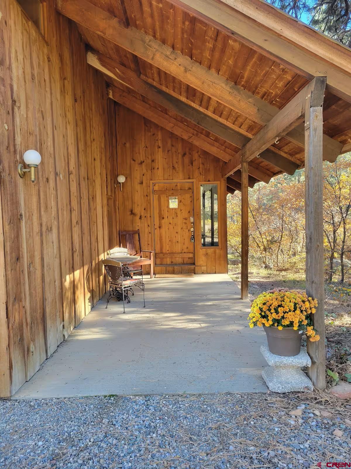 360 Sortais Road Durango, CO 81301 - Photo 2 of 36 a view of a porch with furniture and floor to ceiling window