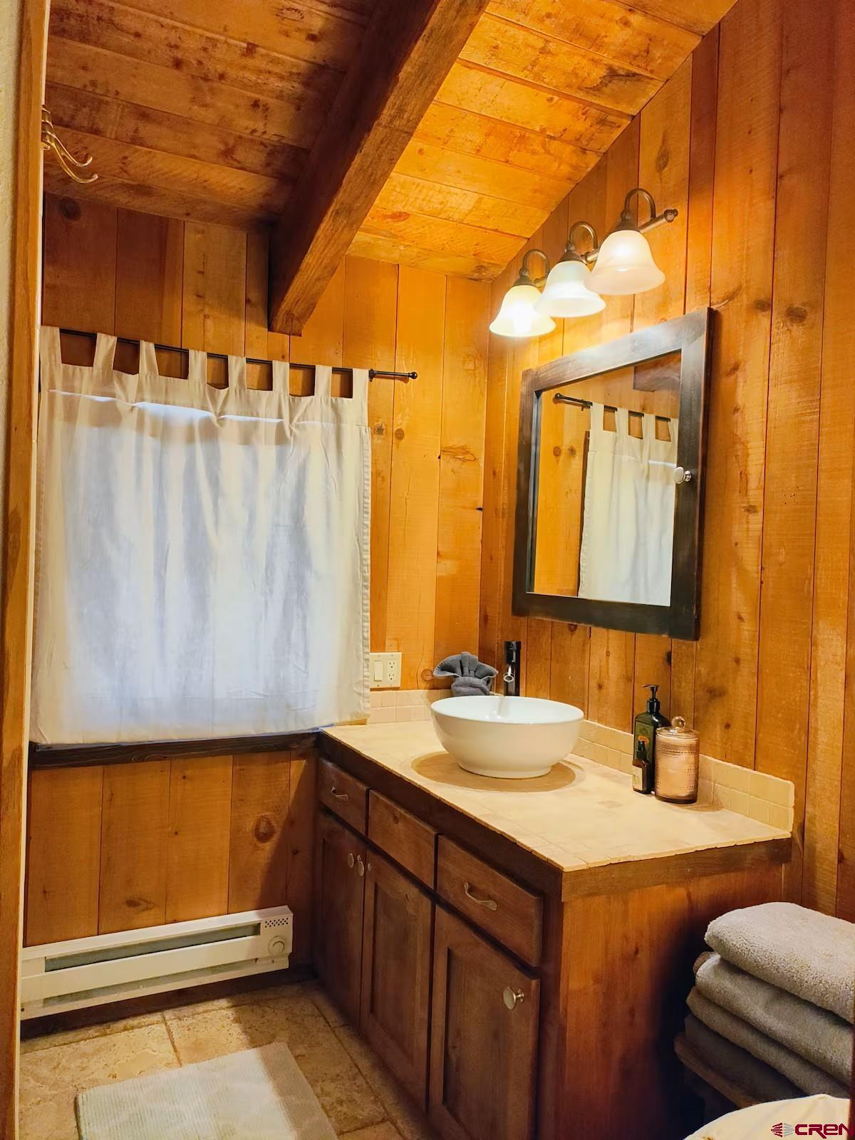 360 Sortais Road Durango, CO 81301 - Photo 24 of 36 a bathroom with a sink and a mirror