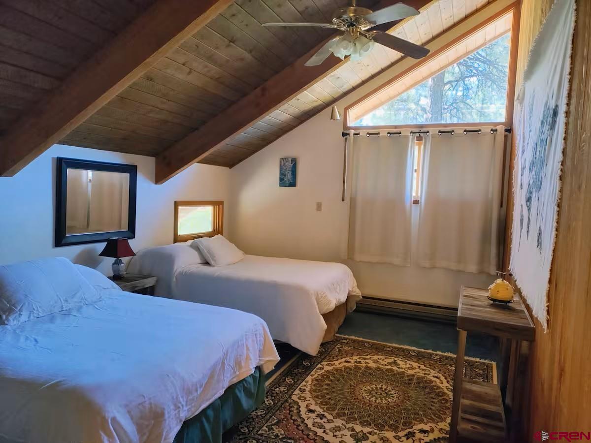 360 Sortais Road Durango, CO 81301 - Photo 25 of 36 a bedroom with bed and wooden floor