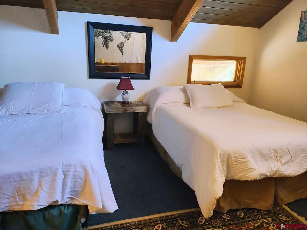 360 Sortais Road Durango, CO 81301 - Photo 26 of 36 a bedroom with a bed and window