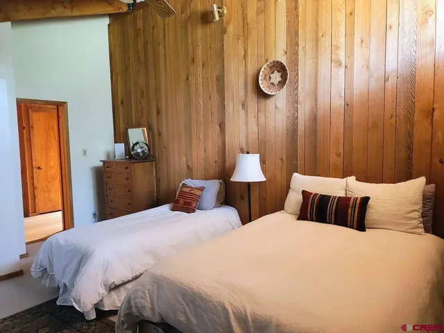 a bedroom with bed and window