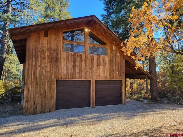 a house with a tree in front of it