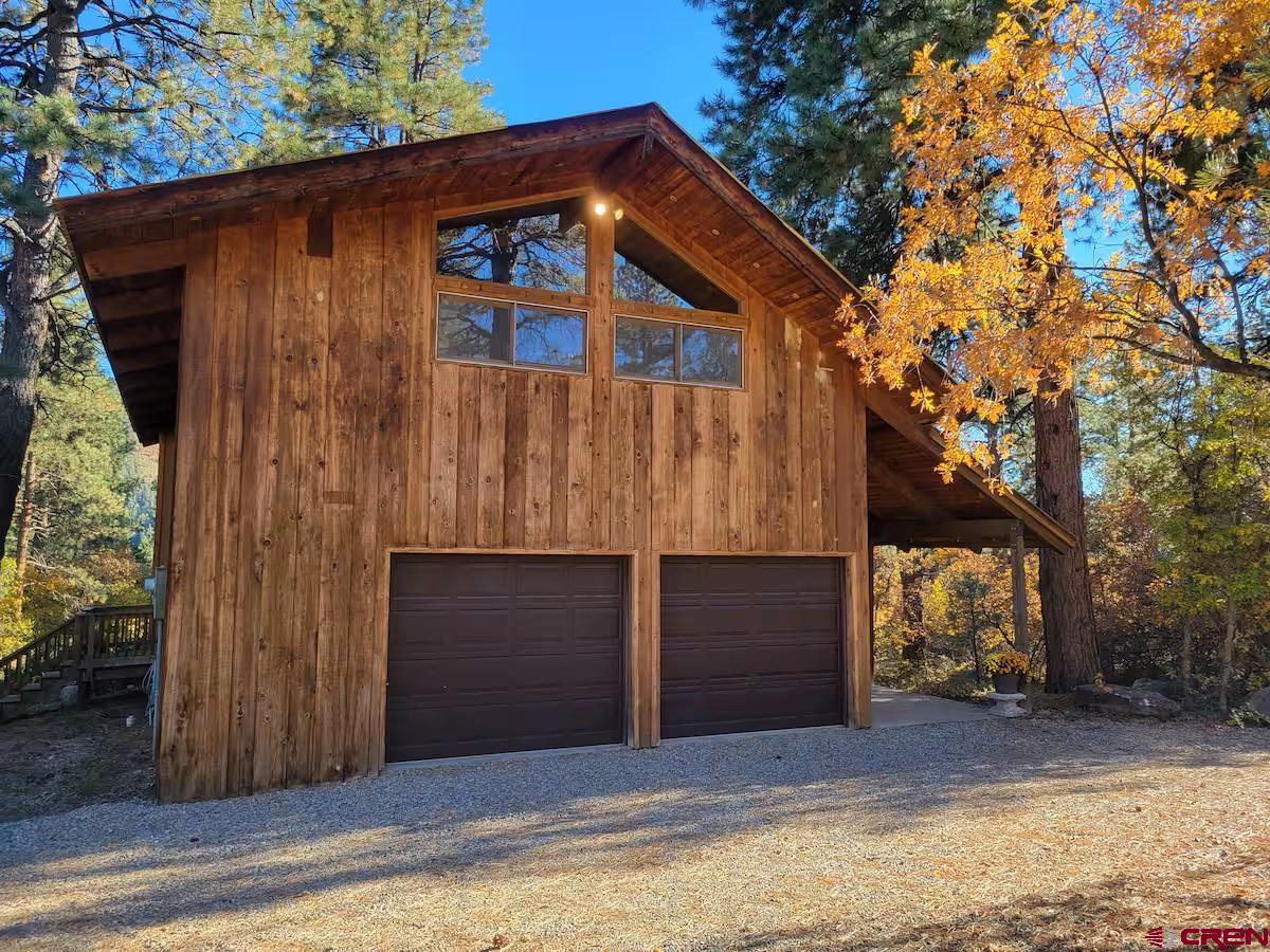 360 Sortais Road Durango, CO 81301 - Photo 3 of 36 a house with a tree in front of it