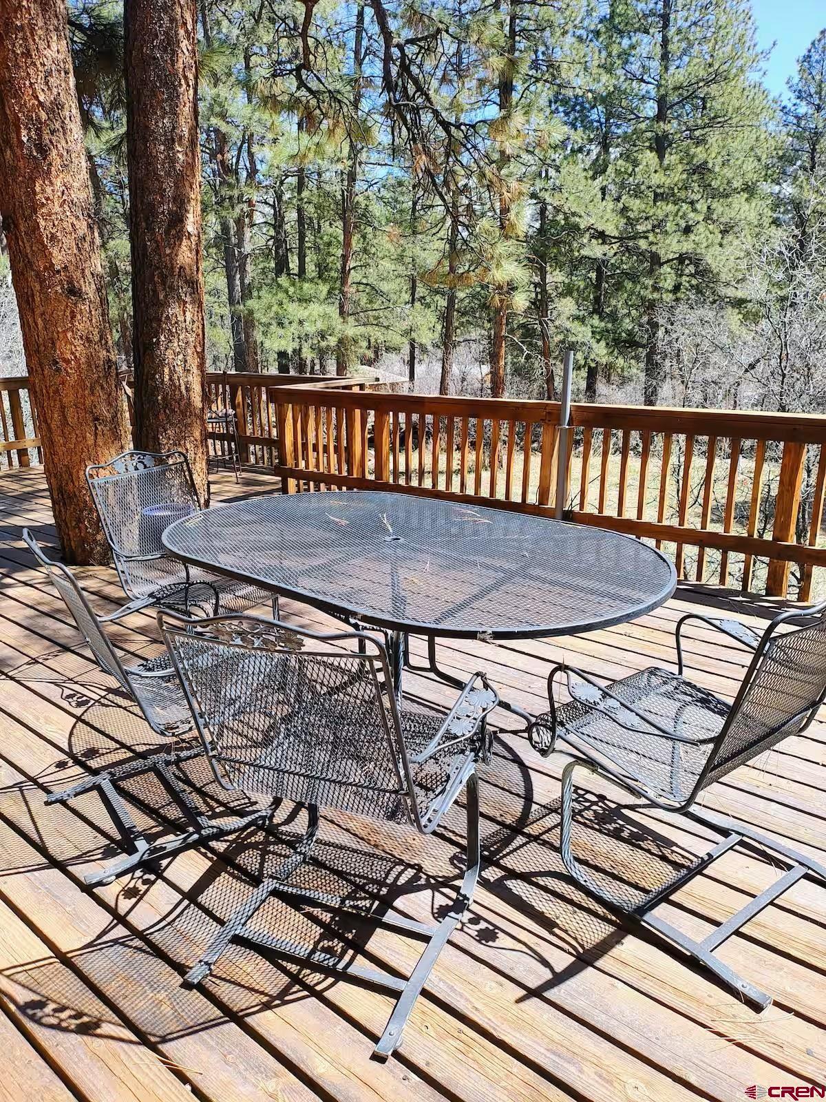 360 Sortais Road Durango, CO 81301 - Photo 34 of 36 a view of a roof deck with wooden floor and fence