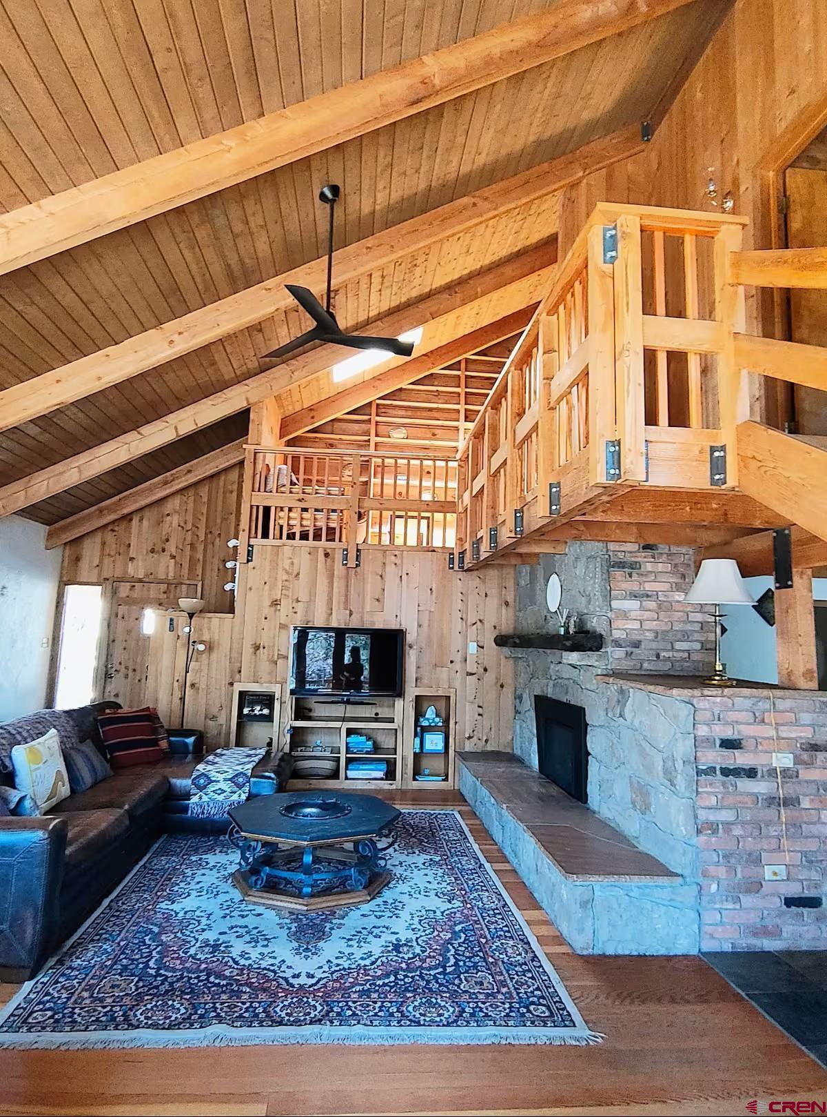 360 Sortais Road Durango, CO 81301 - Photo 8 of 36 a living room with furniture a rug and kitchen view