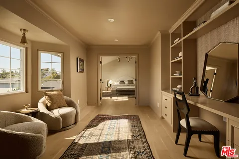 a hallway with furniture and a couch