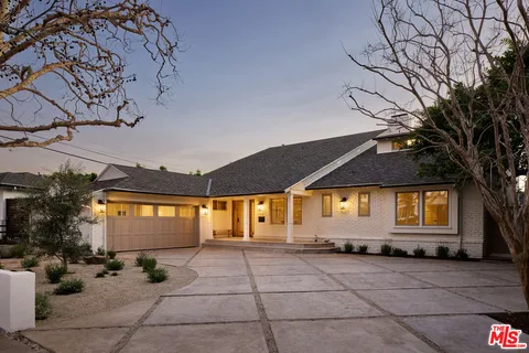 a front view of a house with a garage