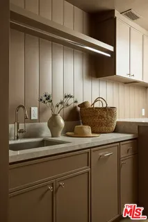 a close view of sink and cabinets