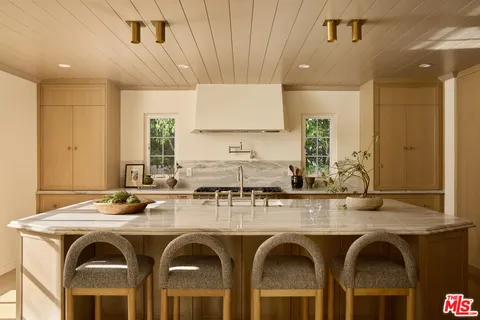 a kitchen with stainless steel appliances granite countertop a sink and a counter space