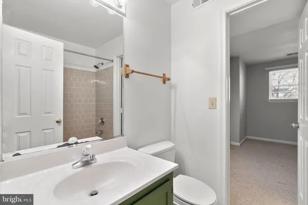 a bathroom with a sink toilet and vanity