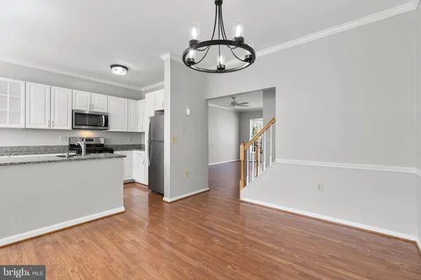 a kitchen with a refrigerator and microwave