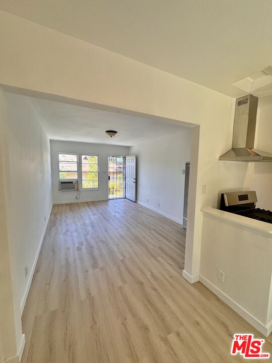 7733 Apperson Street Tujunga, CA 91042 - Photo 11 of 13 a view of empty room with kitchen and window