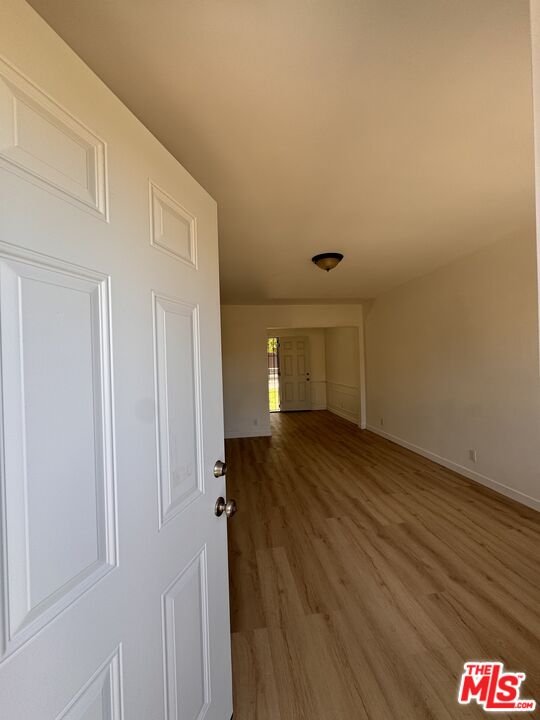 7733 Apperson Street Tujunga, CA 91042 - Photo 13 of 13 a view of a hallway with wooden floor