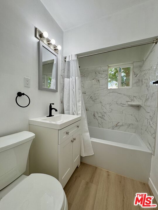 7733 Apperson Street Tujunga, CA 91042 - Photo 3 of 13 a bathroom with a sink a toilet and shower