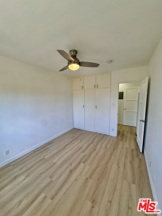 7733 Apperson Street Tujunga, CA 91042 - Photo 5 of 13 a view of empty room with wooden floor