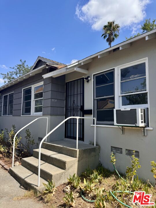 7733 Apperson Street Tujunga, CA 91042 - Photo 6 of 13 a view of a balcony with table and chairs