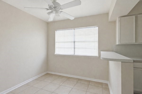1655 Hawthorne Street Houston, TX 77006 - Photo 35 of 39 an empty room with windows and fan