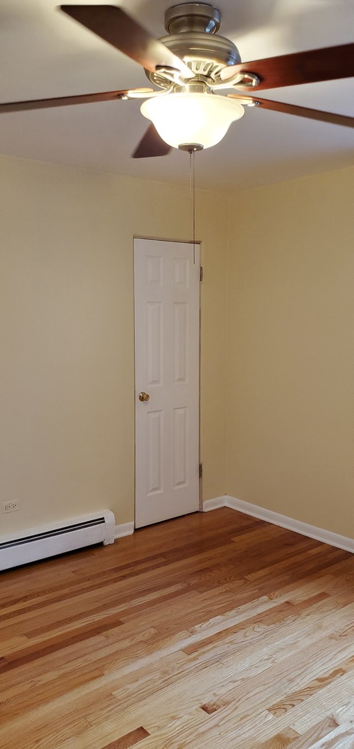 1619 West Howard Street, Unit B3 Chicago, IL 60202 - Photo 10 of 13 a view of a room with wooden floor