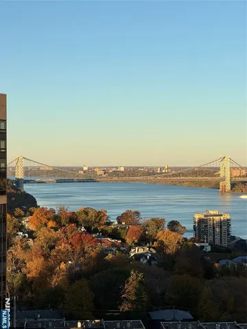 a view of a ocean with outside a house