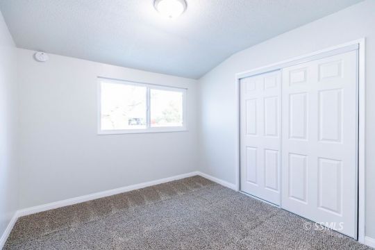 252 North Norma Street Ridgecrest, CA 93555 - Photo 9 of 18 an empty room with windows