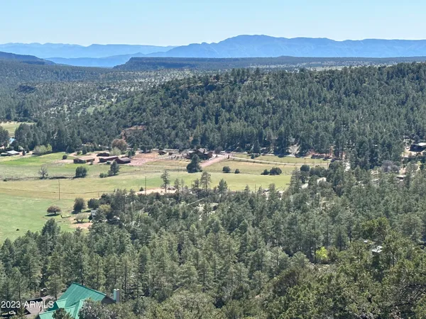 a view of a town with mountains in the background