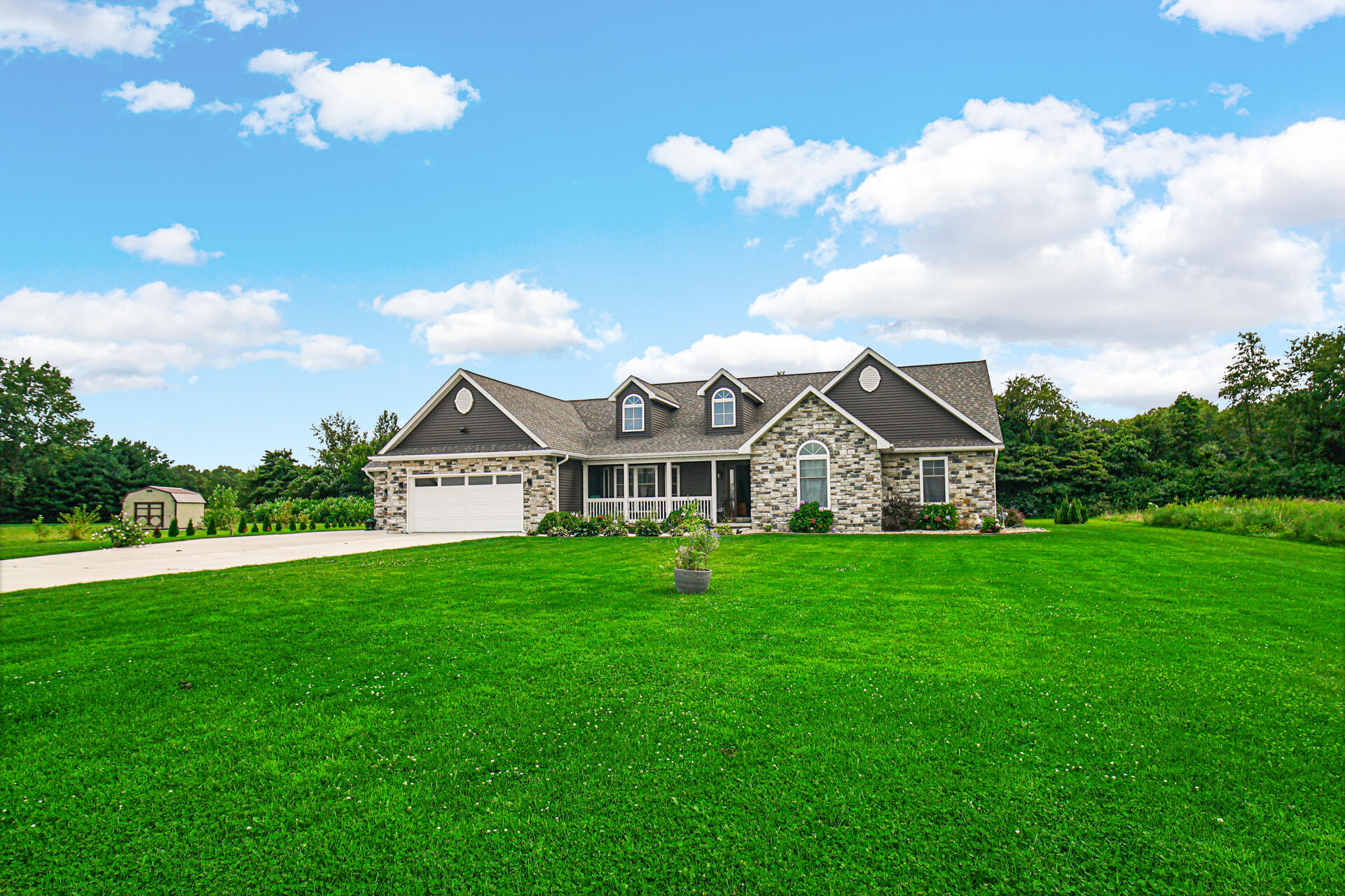 4455 Autumn Ridge Wheatfield, IN 46392 - Photo 1 of 33 a front view of a house with garden