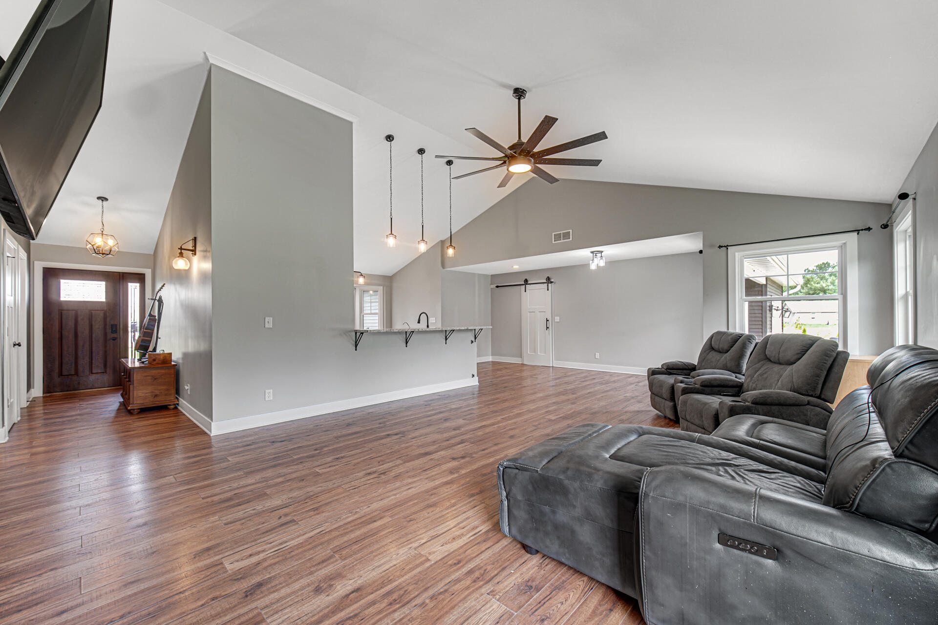 4455 Autumn Ridge Wheatfield, IN 46392 - Photo 12 of 33 a living room with furniture and a wooden floor
