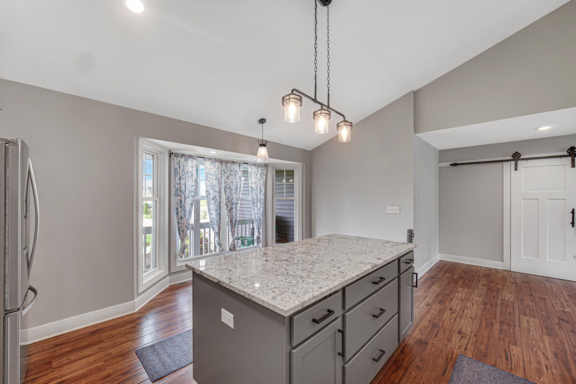4455 Autumn Ridge Wheatfield, IN 46392 - Photo 19 of 33 a kitchen with a table and chairs