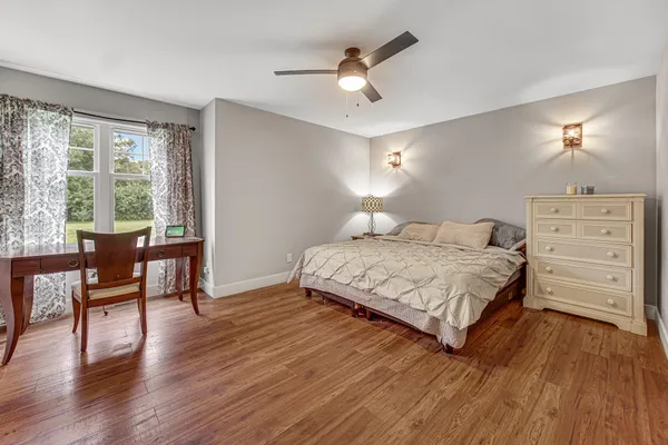 a bedroom with a bed and a table