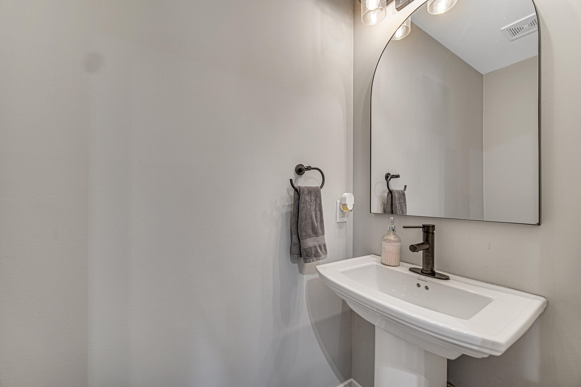 4455 Autumn Ridge Wheatfield, IN 46392 - Photo 28 of 33 a bathroom with a sink and a mirror