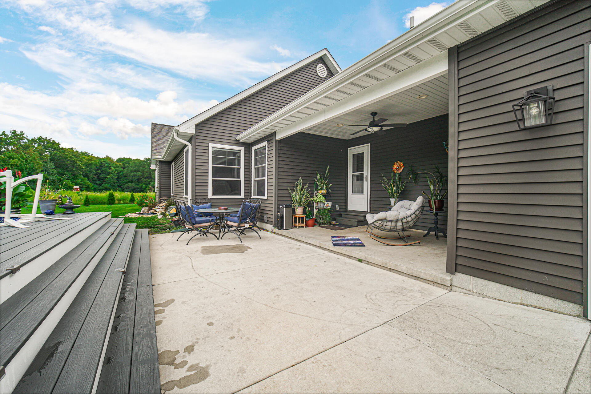 4455 Autumn Ridge Wheatfield, IN 46392 - Photo 7 of 33 a view of a patio with table and chairs and floor to ceiling window