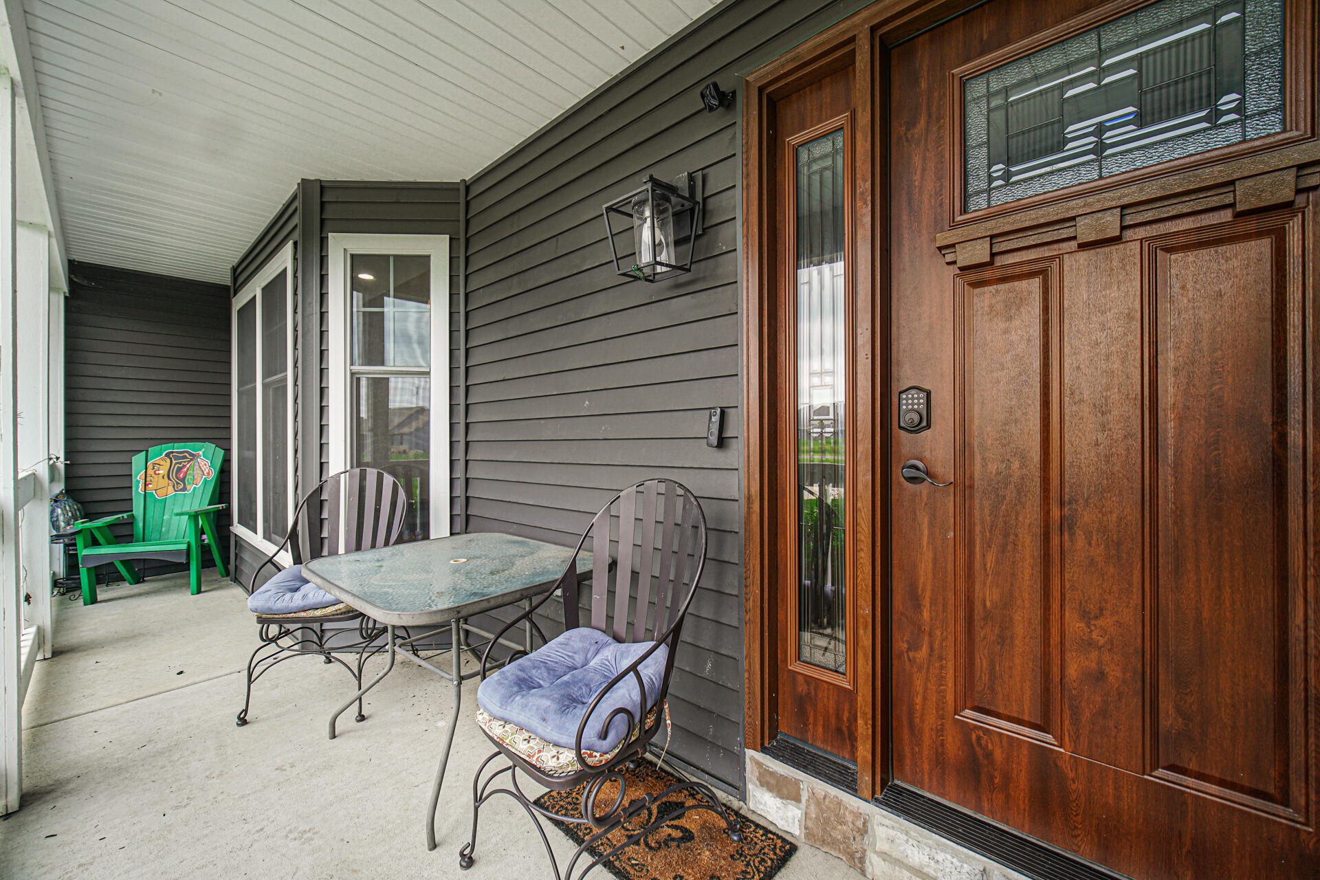 4455 Autumn Ridge Wheatfield, IN 46392 - Photo 9 of 33 a backyard of a house with barbeque oven table and chairs