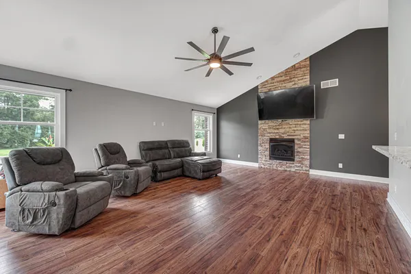 a living room with furniture and a fireplace
