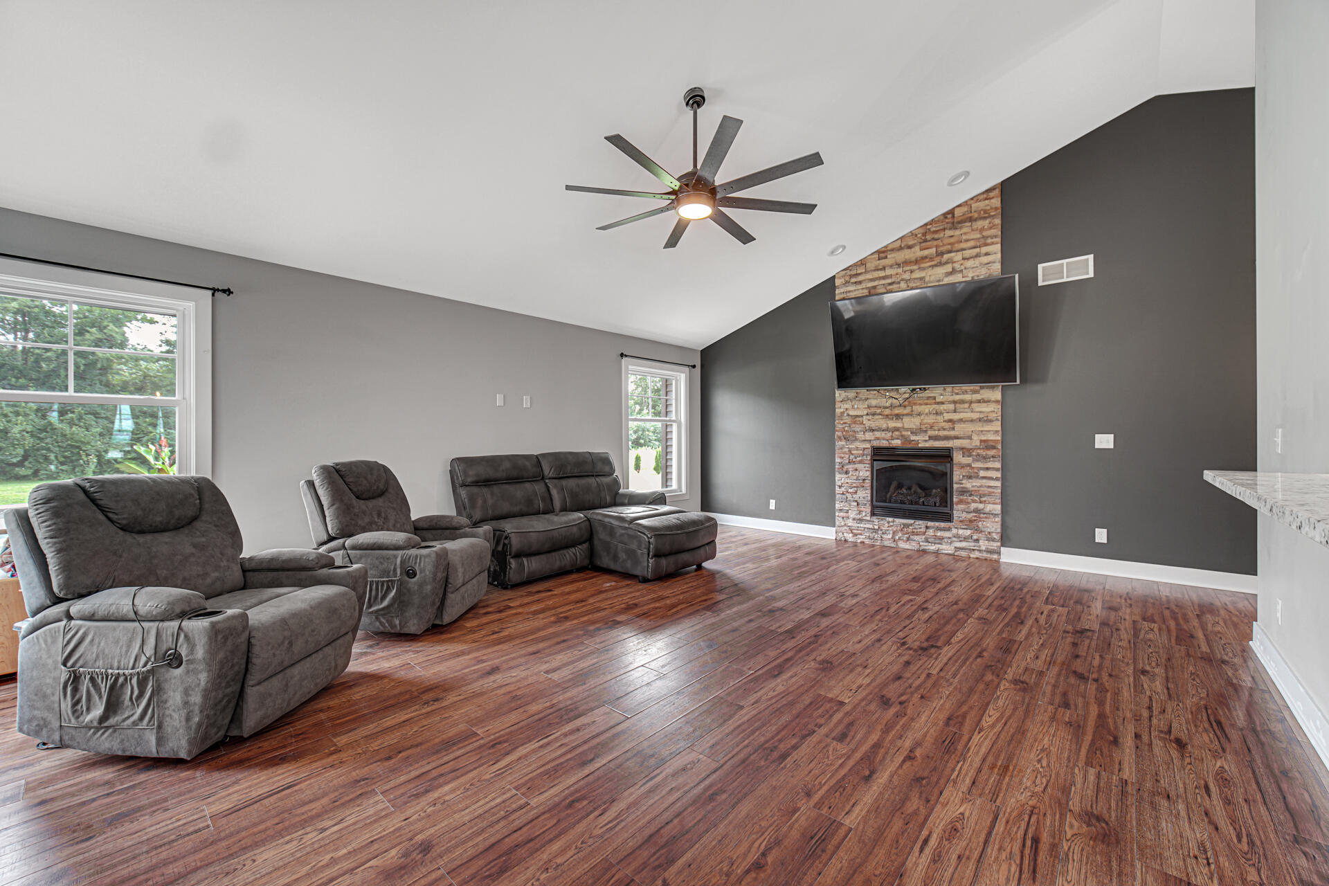 4455 Autumn Ridge Wheatfield, IN 46392 - Photo 10 of 33 a living room with furniture and a fireplace