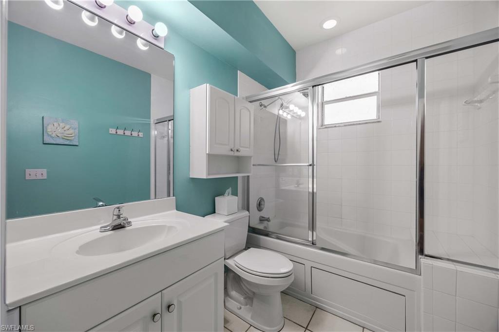 290 Robin Hood Circle, Unit 201 Naples, FL 34104 - Photo 19 of 34 a bathroom with a sink toilet and shower